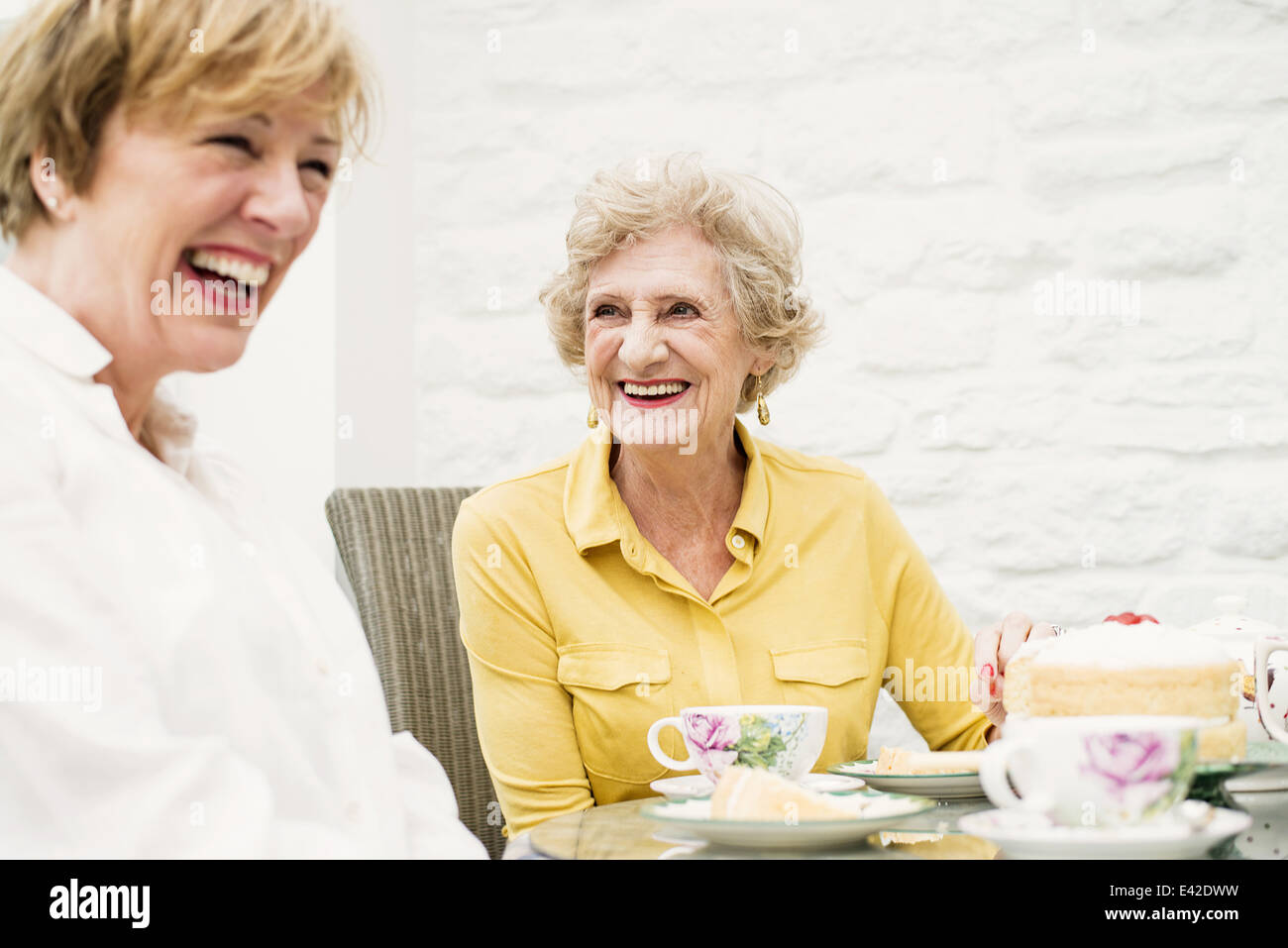 Senior woman and daughter having tea Stock Photo