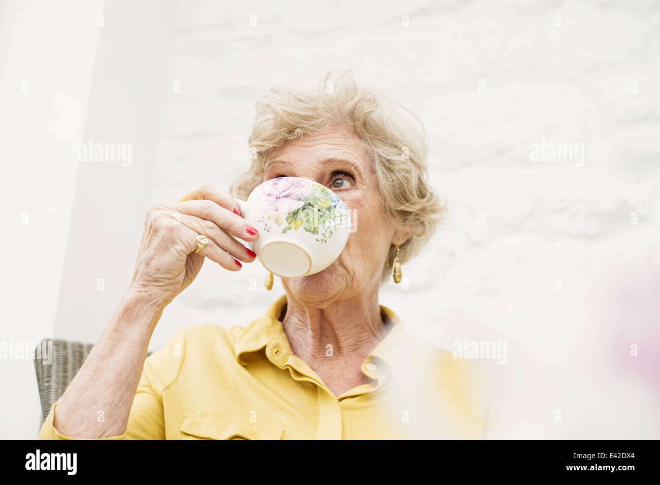 Senior woman drinking tea Stock Photo