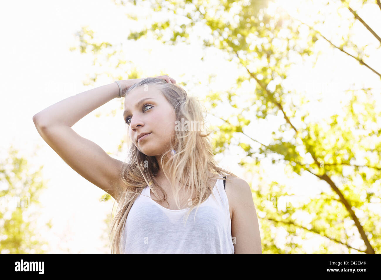 Young woman with hand in hair Stock Photo