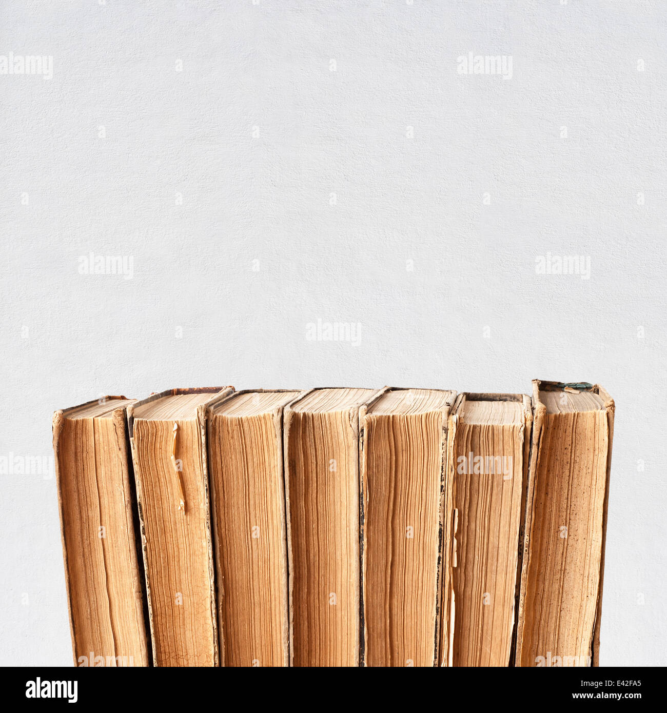 vintage old books near the wall background Stock Photo Alamy