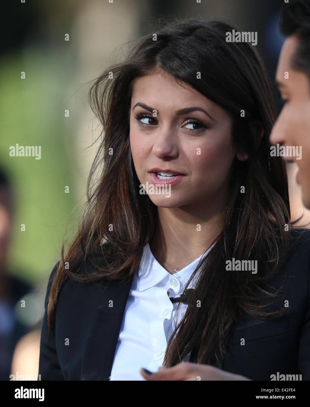 Nina Dobrev appears on Extra hosted by Mario Lopez. Nina Dobrey eats a