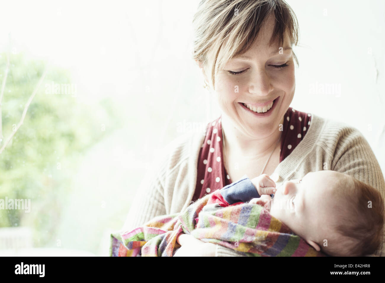 Mother holding her son in an event hi-res stock photography and images ...