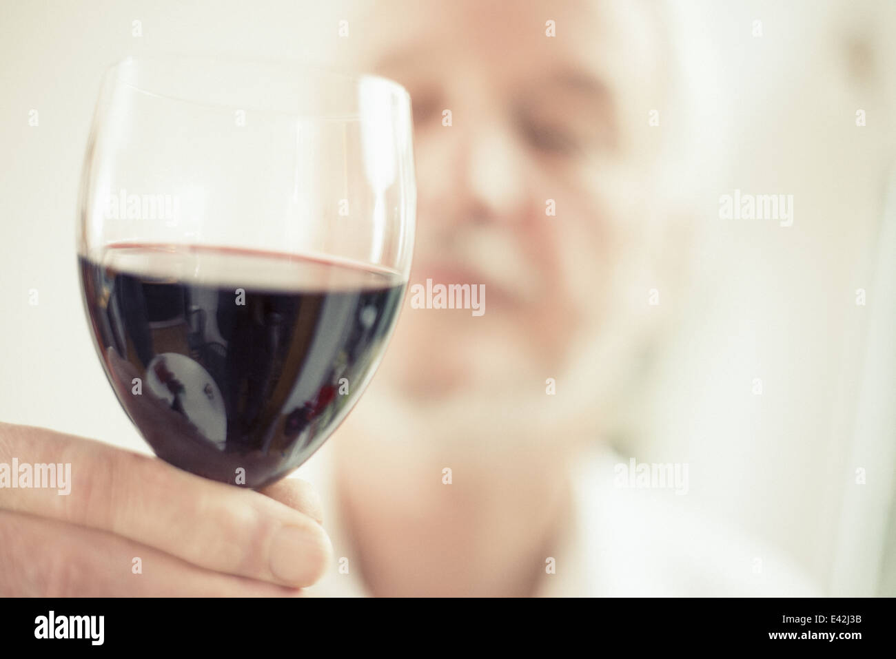 Man holding red wine, close up Stock Photo
