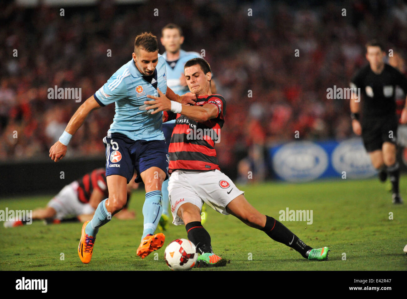 Tomi Juric held back by Nikola Petkovic Australia A-League football match. Western Sydney Wanderers wins the local derby with Sydney FC 1-0  Featuring: Tomi Juric Where: Sydney, Australia When: 11 Jan 2014 Stock Photo