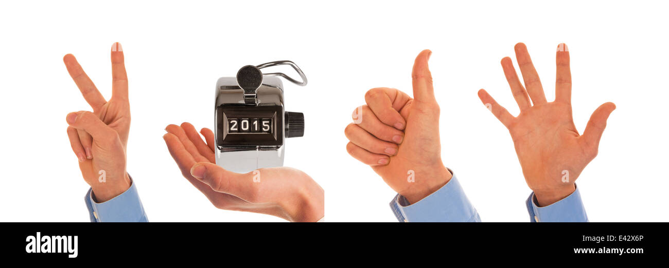 Male hands with analog pedometer display picturing the year 2015 Stock Photo