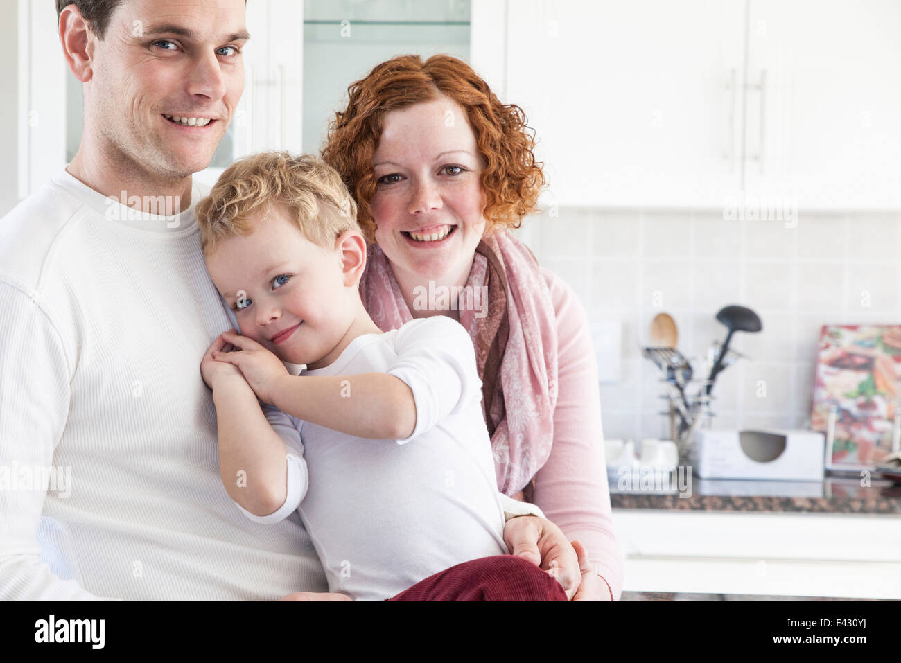 Portrait of mid adult couple and four year old son Stock Photo