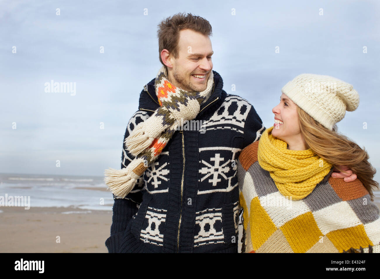 Portrait of mid adult couple strolling on beach, Bloemendaal aan Zee, Netherlands Stock Photo