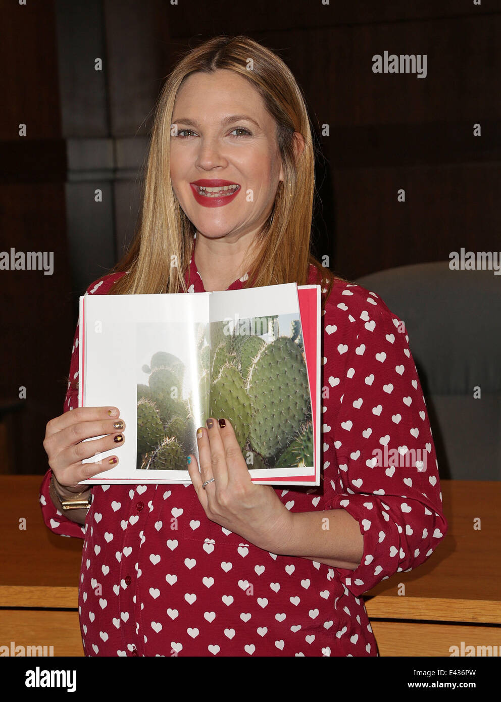 Actress Drew Barrymore poses at her book signing for "Find It In