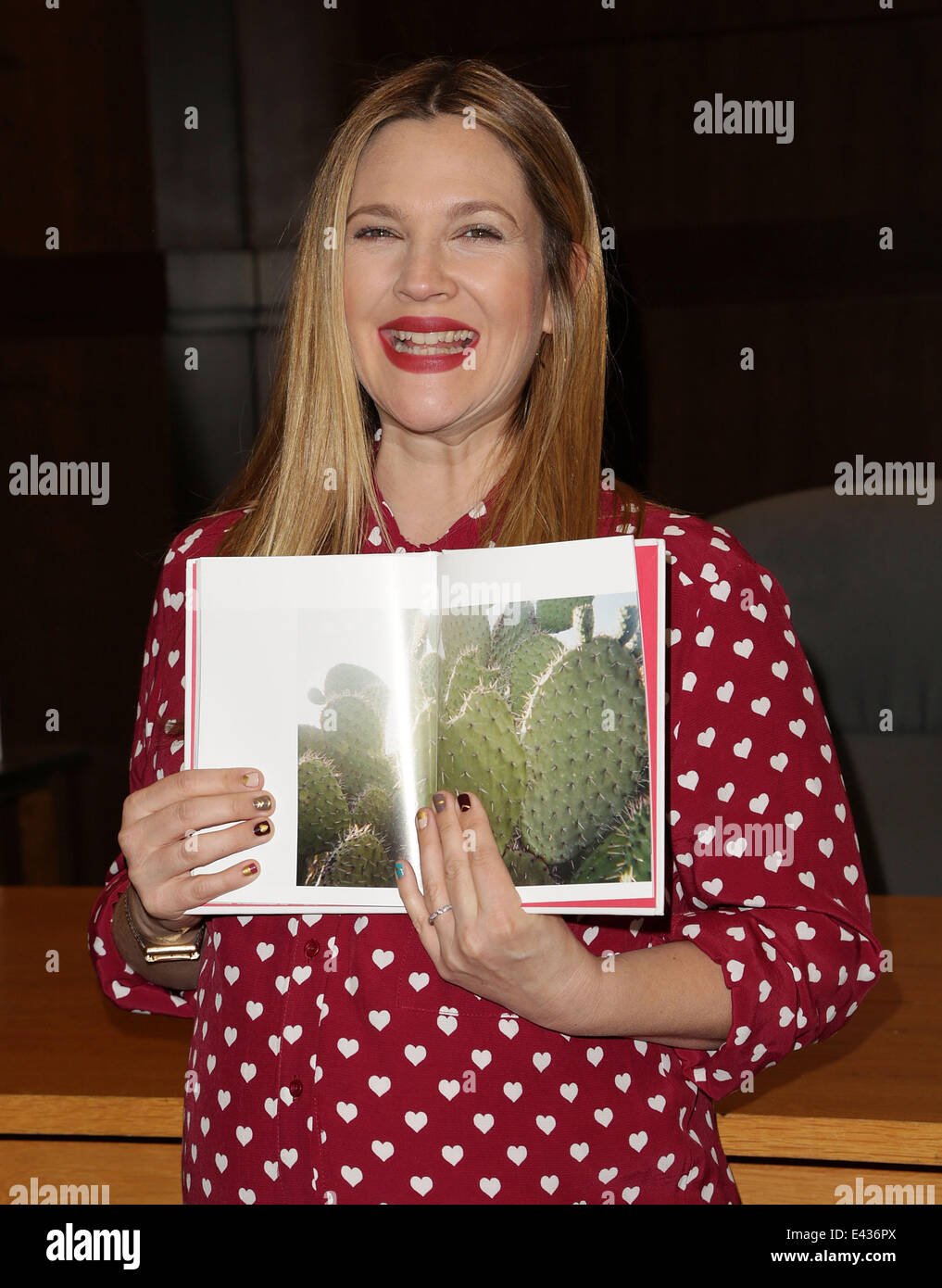 Actress Drew Barrymore poses at her book signing for "Find It In