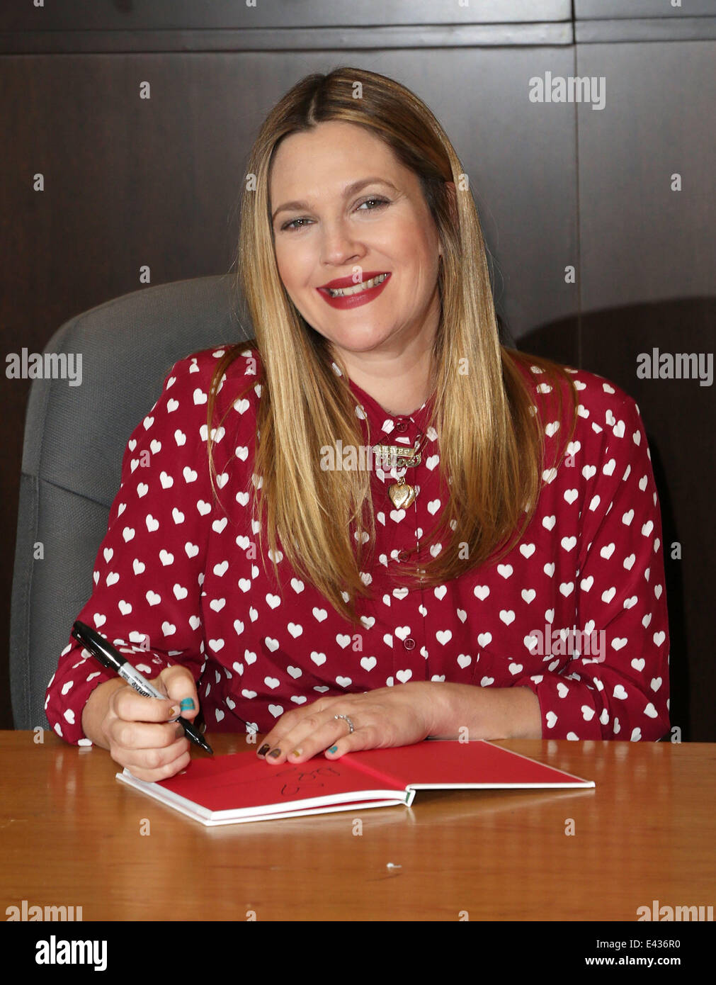 Actress Drew Barrymore poses at her book signing for "Find It In