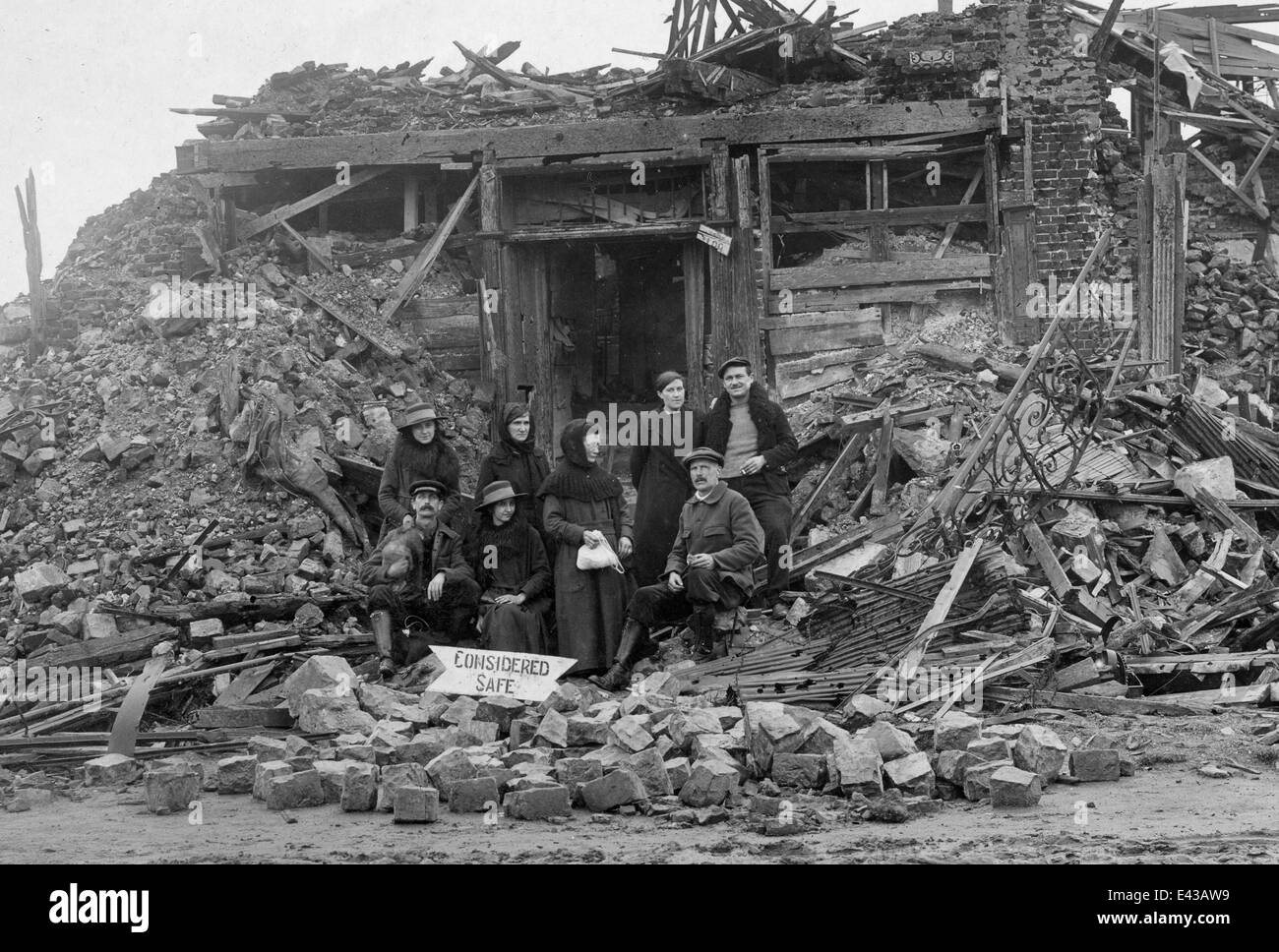 World War 1 WW1 French family ouside their home destroyed by shelling at La Bassée in Nord-Pas-de-Calais 1918 Stock Photo