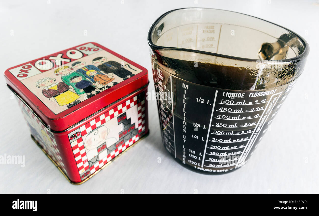 Old Oxo cube tin and measuring jug Stock Photo - Alamy