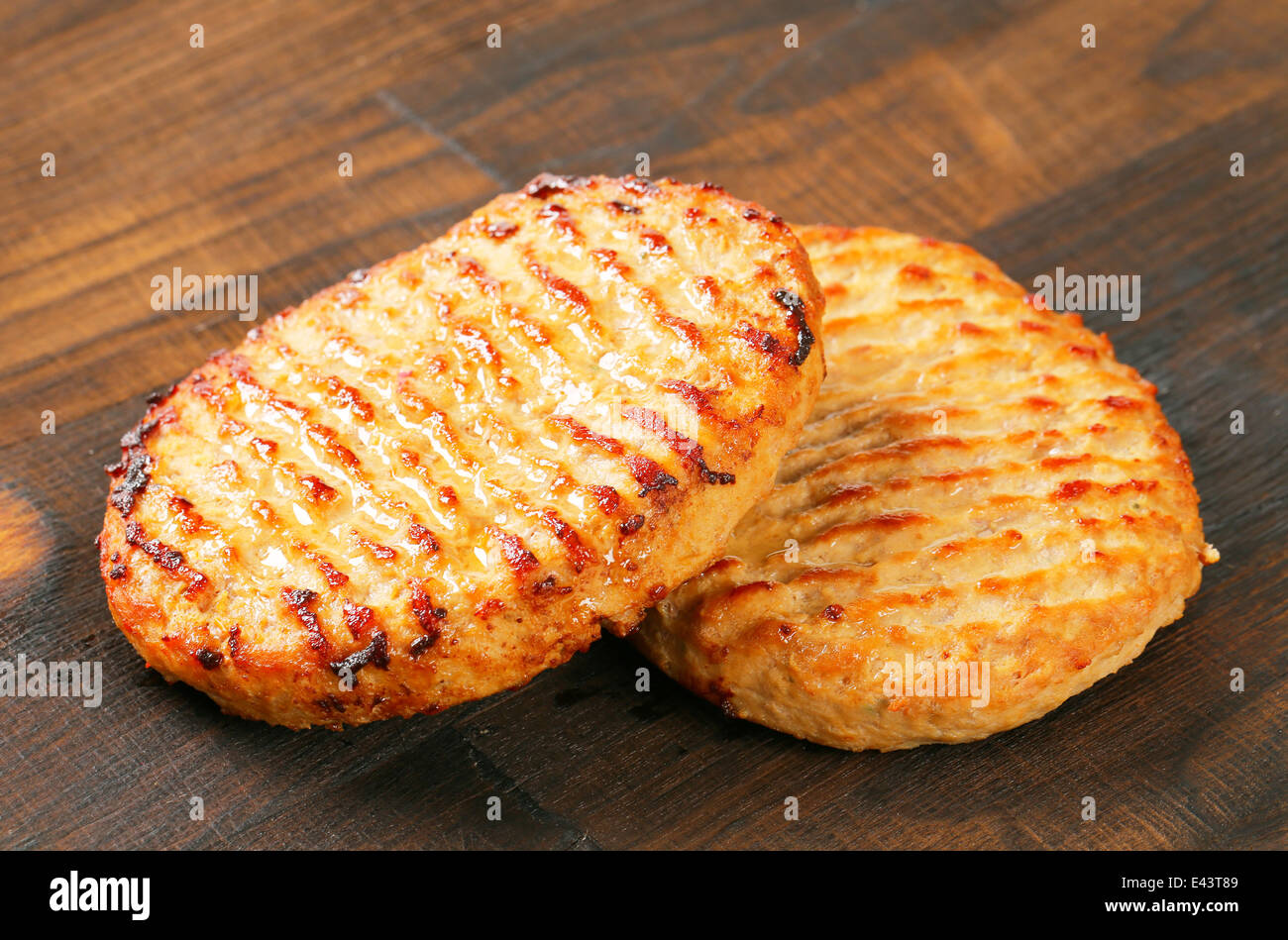 Pan fried burger patties on cutting board Stock Photo Alamy