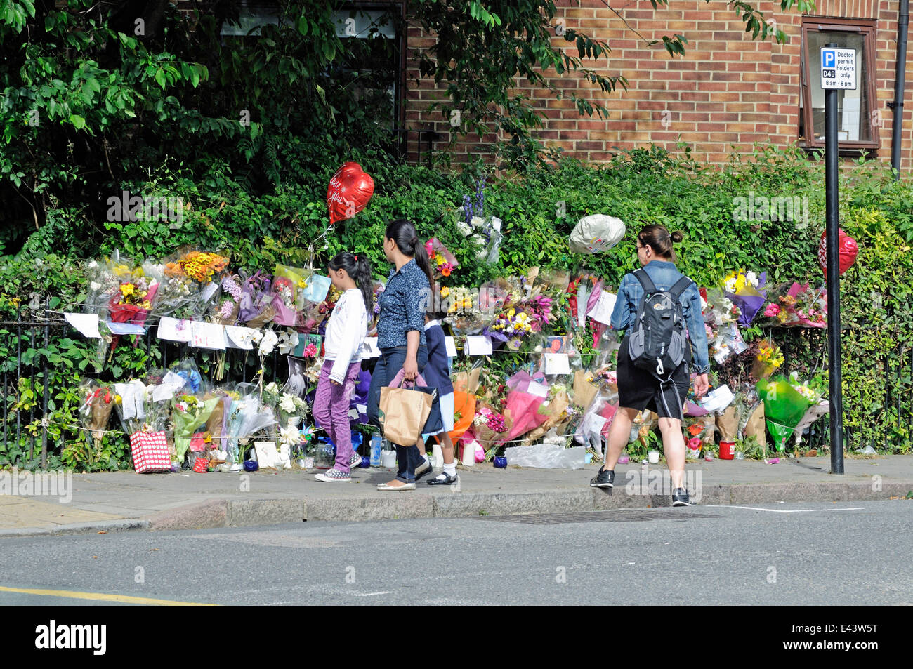 People looking at memorial to the victim of stabbing Highbury London Borough of Islington England Britain UK Stock Photo