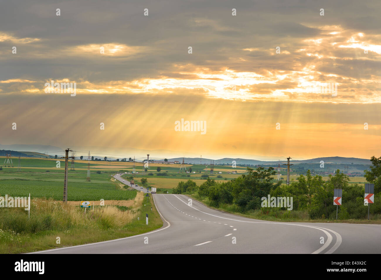 Sinuous Road in Summer Day, sunset scenery Stock Photo