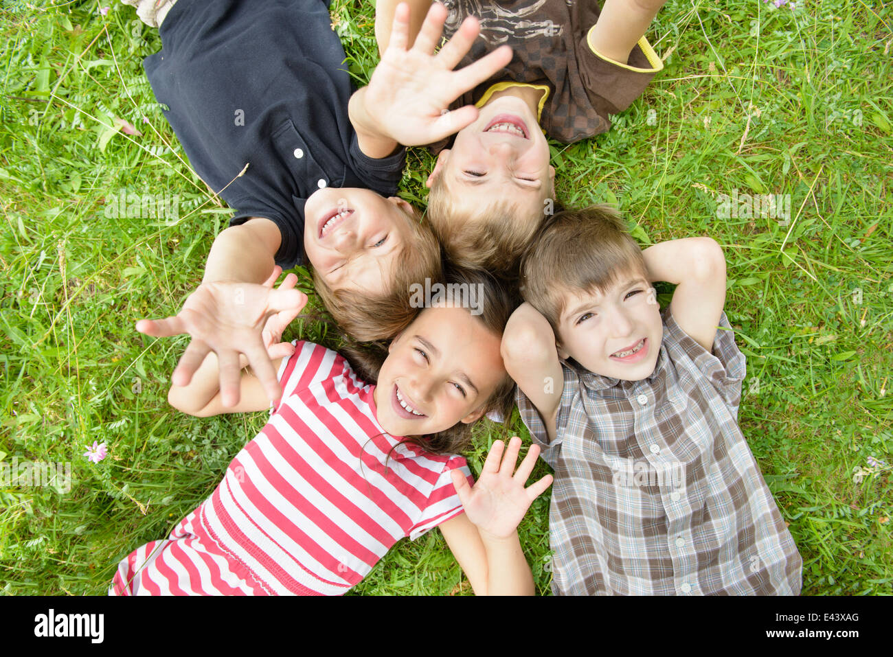 For happy kids on grass in summer day Stock Photo - Alamy
