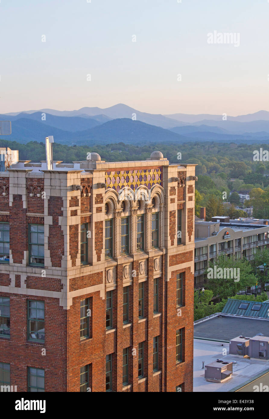 View overlooking part of Asheville, NC at sunset with a art deco