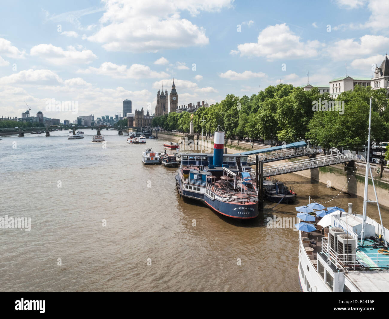 Tattershall Castle, a ship moored on the Victoria Embankment, London used as a restaurant and bar, Houses of Parliament behind Stock Photo