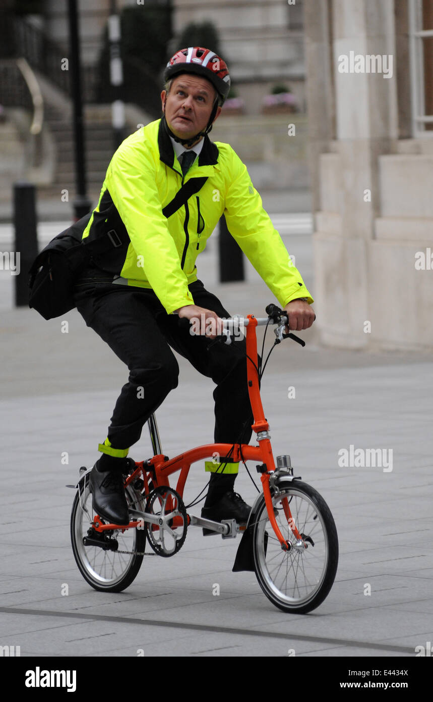 Hugh Bonneville riding a cycle whilst filming at the BBC Featuring: Hugh  Bonneville Where: London, United Kingdom When: 24 Jan 2014 Stock Photo -  Alamy