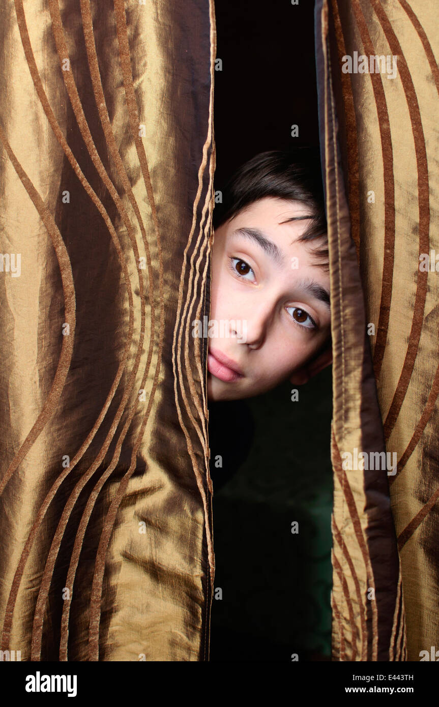 Child hiding behind curtain hires stock photography and images Alamy