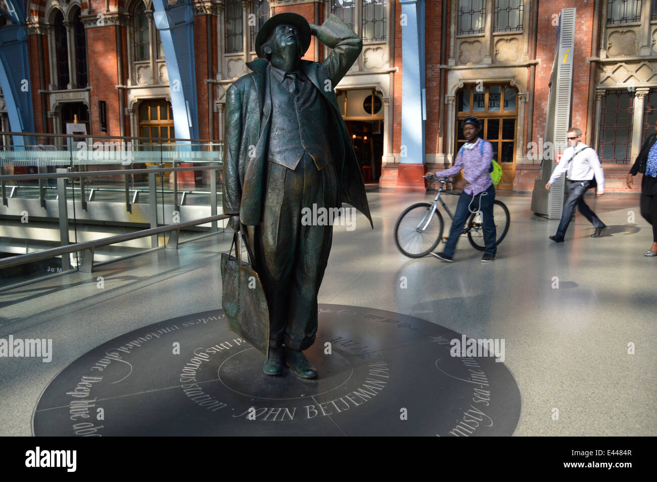 A statue of the writer and saver of St. Pancras Station, Sir John Betjeman, in newly renovated station, London, England, UK Stock Photo