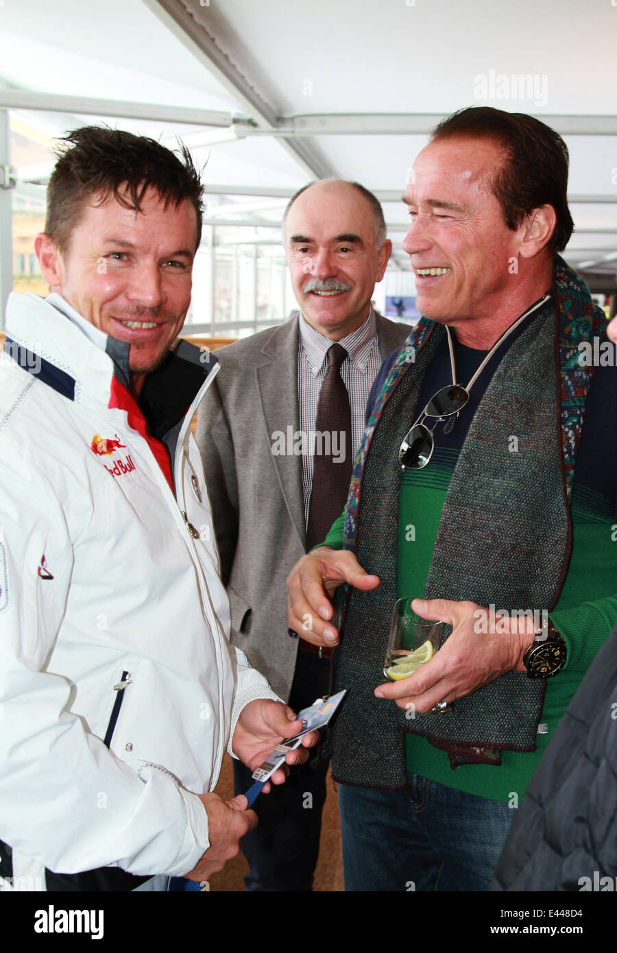 Arnold Schwarzenegger and girlfriend Heather Milligan at the 2014 FIS Alpine World Cup  Featuring: Arnold Schwarzenegger,Felix Baumgartner Where: Kitzbuehel, Austria When: 25 Jan 2014 Stock Photo