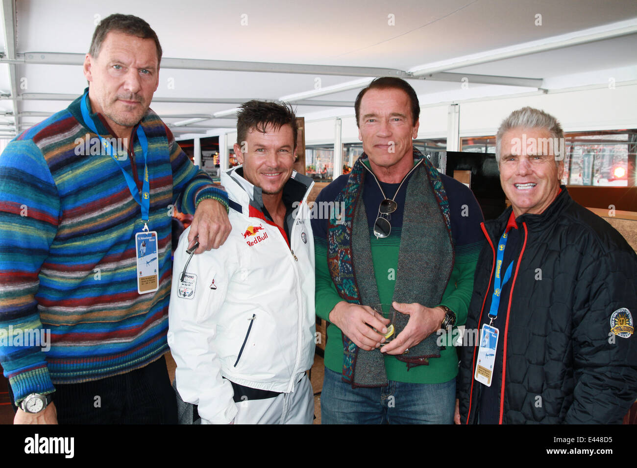 Arnold Schwarzenegger and girlfriend Heather Milligan at the 2014 FIS Alpine World Cup  Featuring: Ralf Moller,Arnold Schwarzenegger,Felix Baumgartner Where: Kitzbuehel, Austria When: 25 Jan 2014 Stock Photo