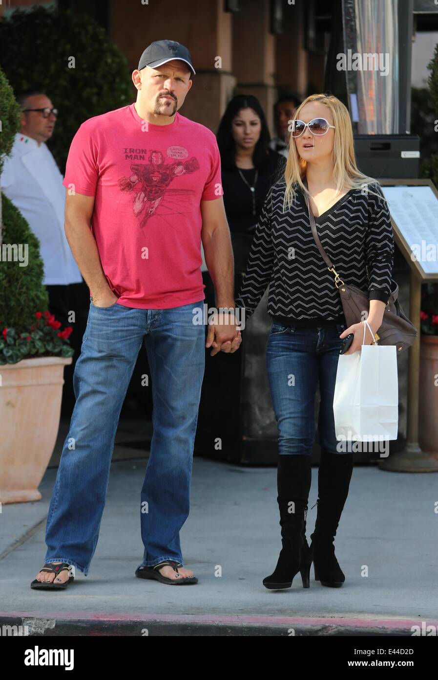 Mickey Rourke has lunch with Chuck Liddell and his wife, Heidi at Via Alloro in Beverly Hills.  Featuring: Chuck Liddell,Heidi Northcott Where: Los Angeles, California, United States When: 27 Jan 2014 Stock Photo