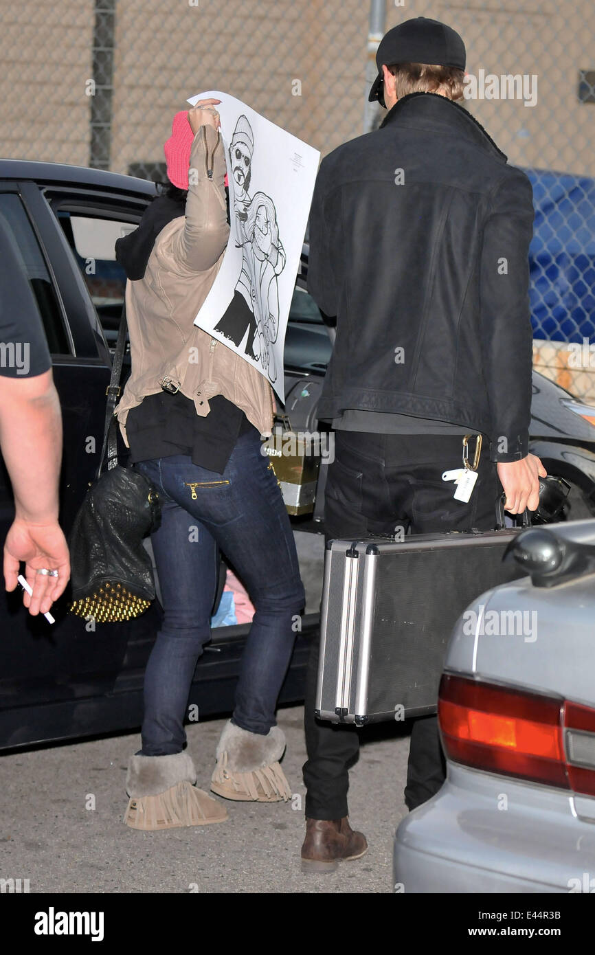 Austin Butler exits a gun range along with his girlfriend Vanessa