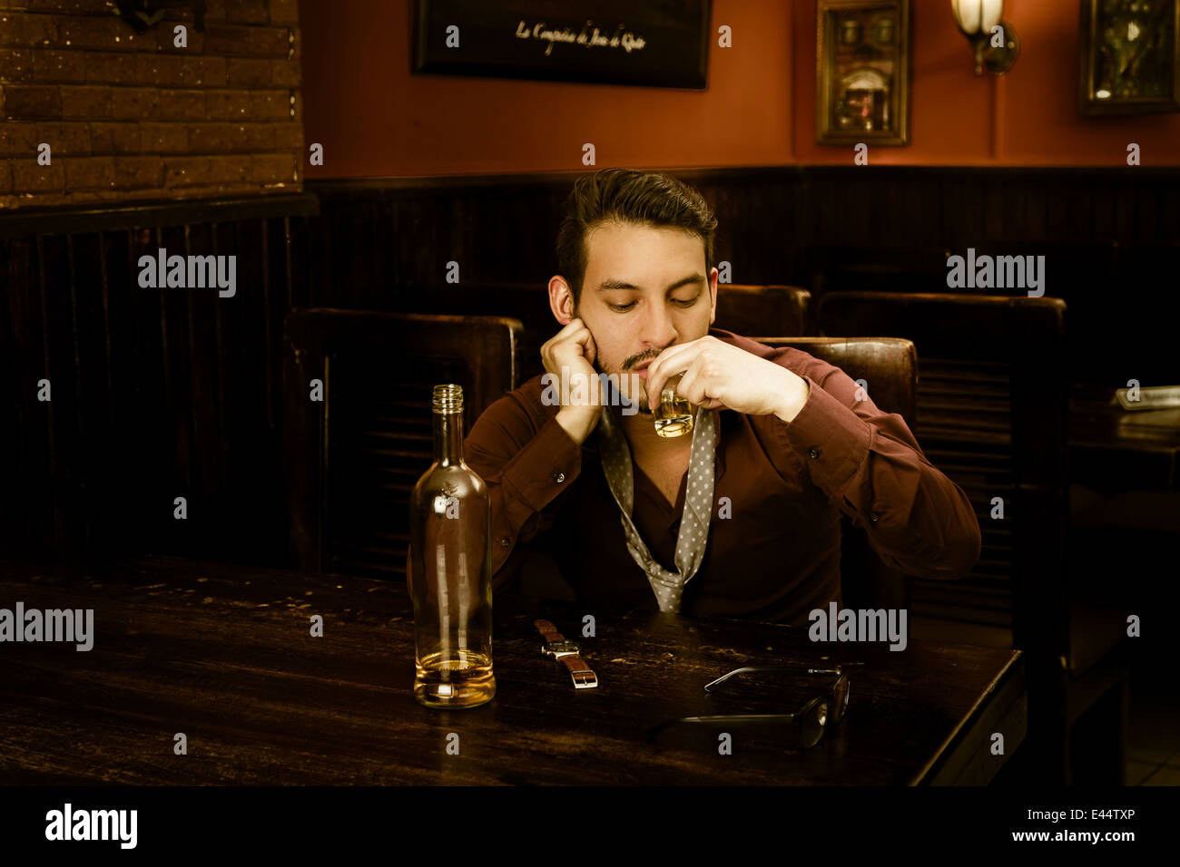 latin guy drinking shots getting drunk Stock Photo Alamy