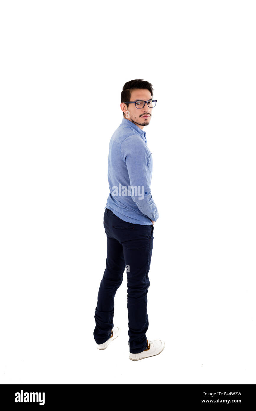 young hispanic man with blue shirt and glasses posing Stock Photo - Alamy