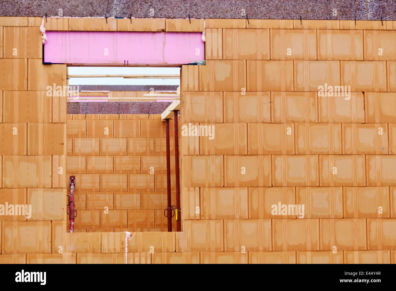 A brick shell of a house in massive construction. Built in brick Stock ...