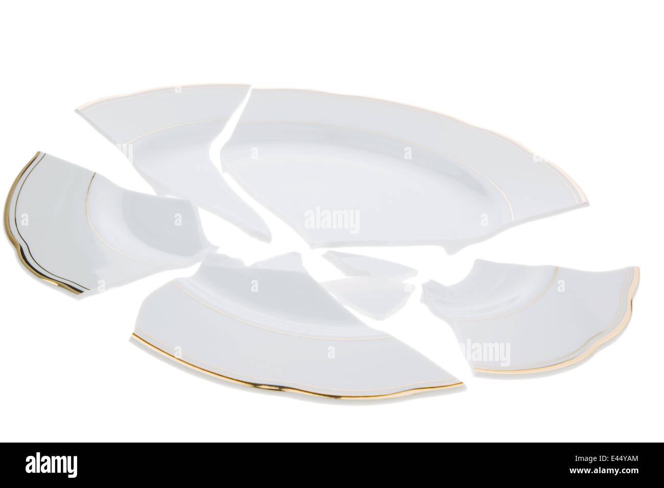 A broken plate lies on a white background Stock Photo Alamy