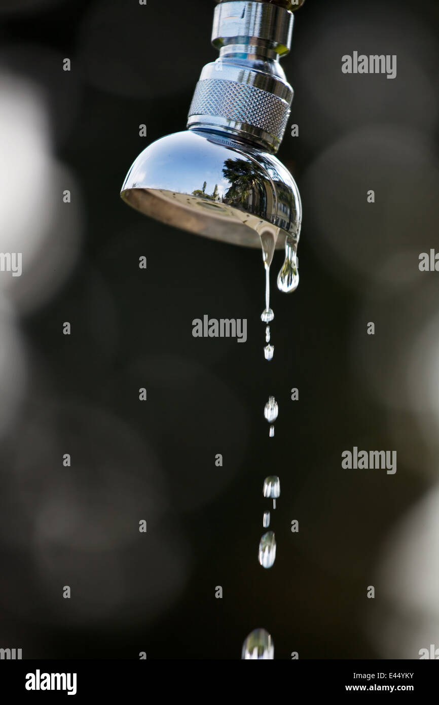 The water drops of a shower. Shower stands in the garden Stock Photo ...