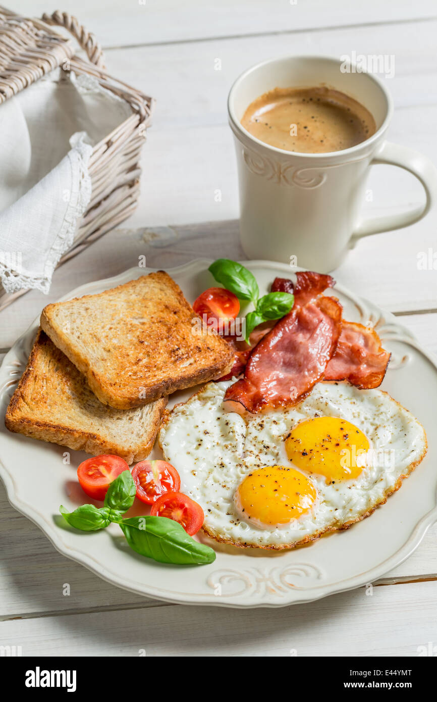 Eggs, bacon, toast and coffee for breakfast Stock Photo - Alamy