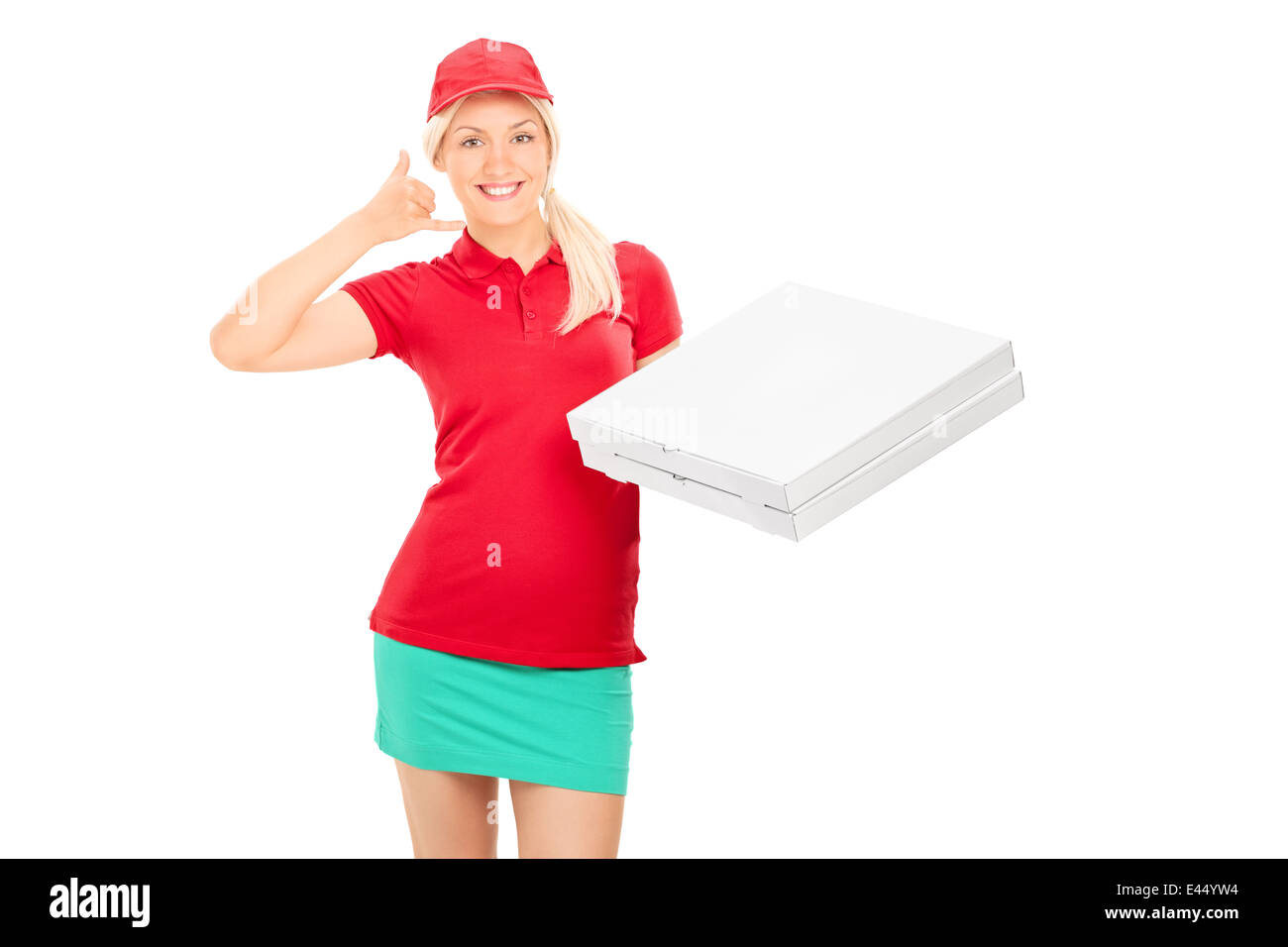 Delivery girl making a call sign and holding pizza boxes Stock Photo