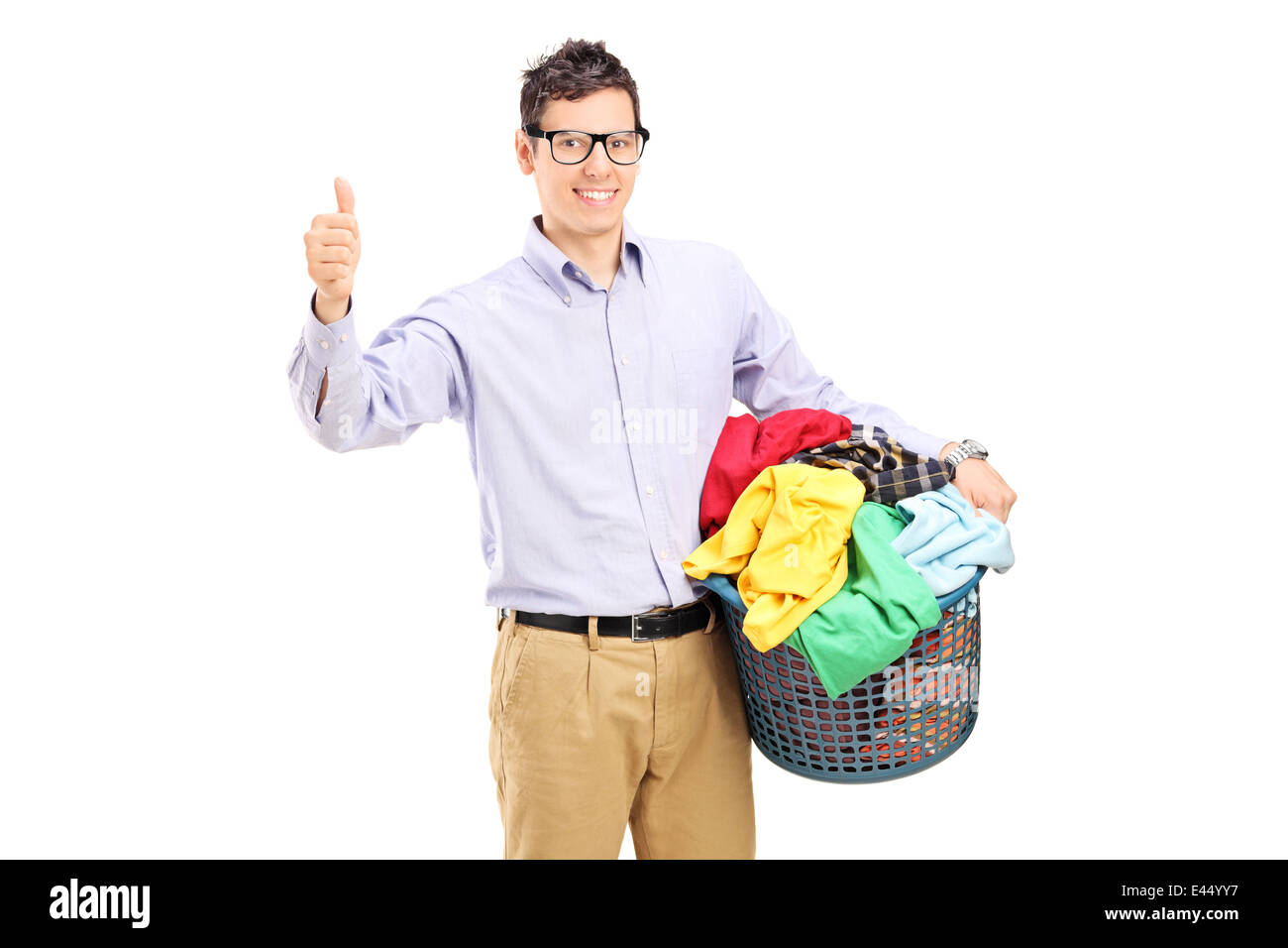 Man holding a laundry basket and giving thumb up Stock Photo