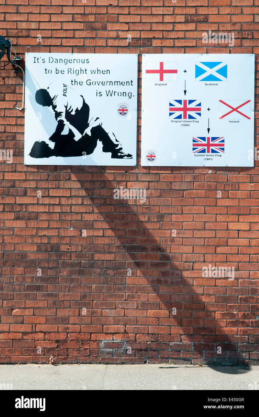 Sign on a wall in Carrickfergus saying 'It's dangerous to be right when the Government is wrong' Stock Photo