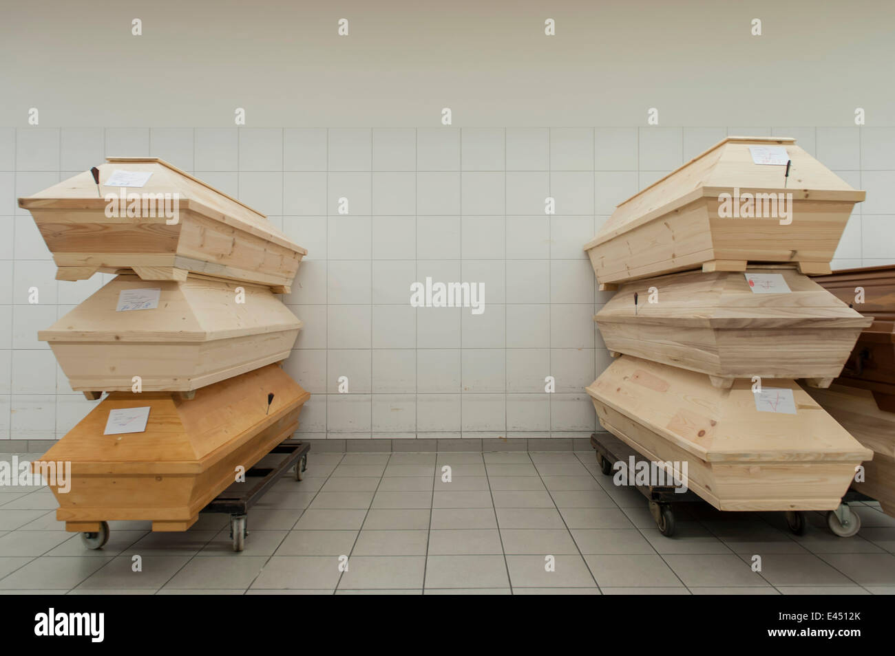 Coffins containing dead bodies are stacked up in a crematorium ready for cremation, Essen, North Rhine-Westphalia, Germany Stock Photo