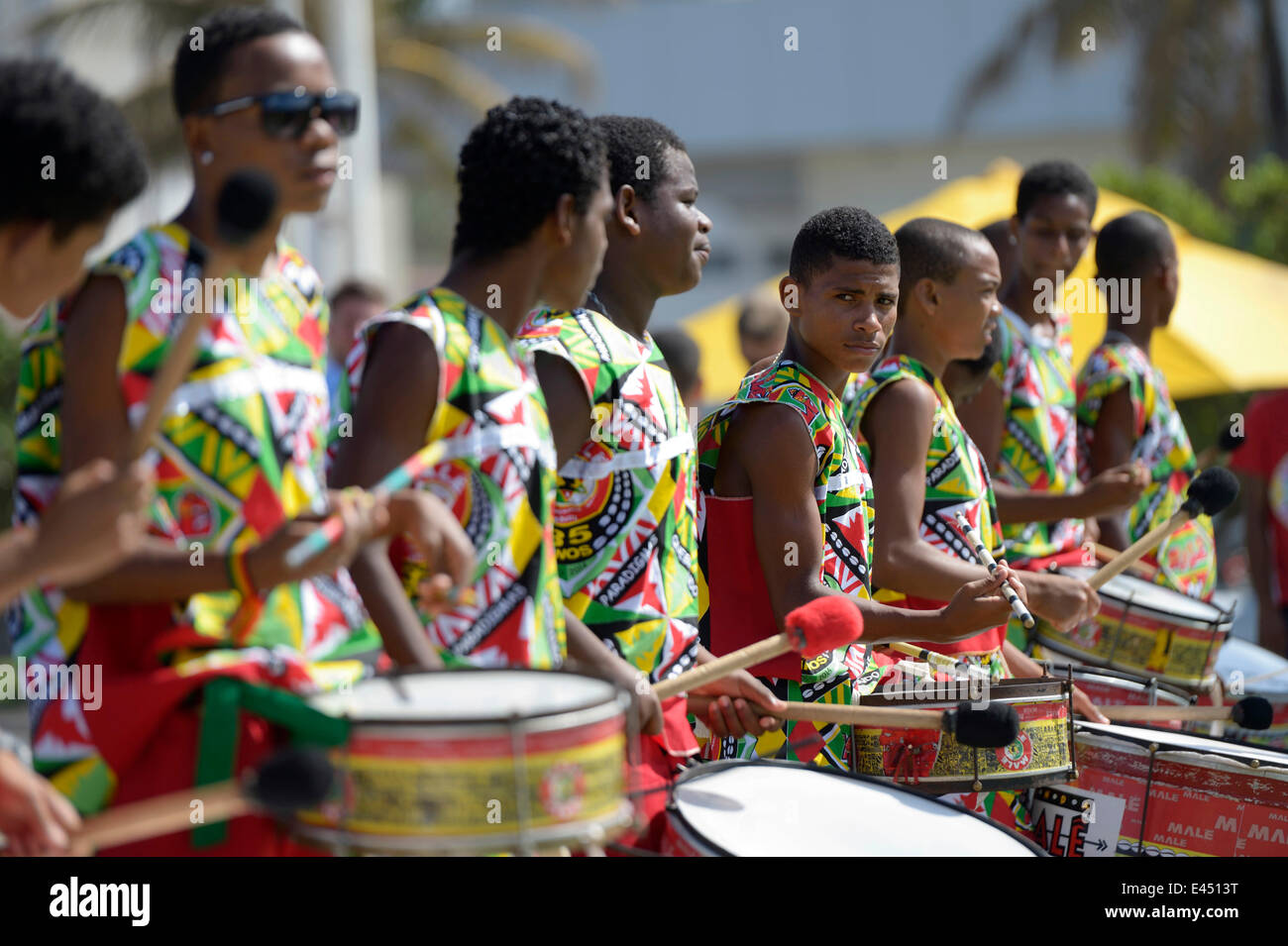 Drummers, colourfully dressed teenagers of a traditional Afro-Brazilian musical group, Salvador da Bahia, Bahia, Brazil Stock Photo