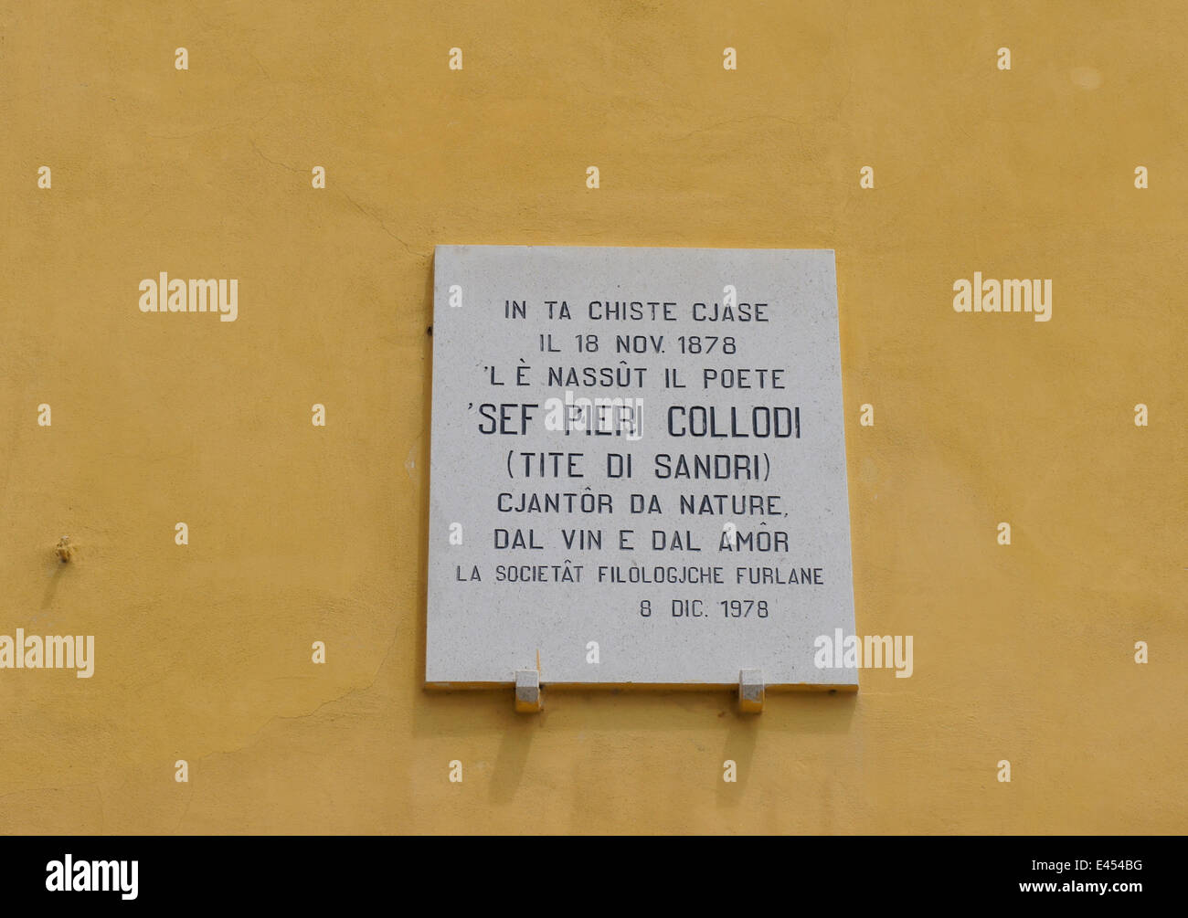 Plaque commemorating local poet Pieri Collodi in Friulian language Stock Photo