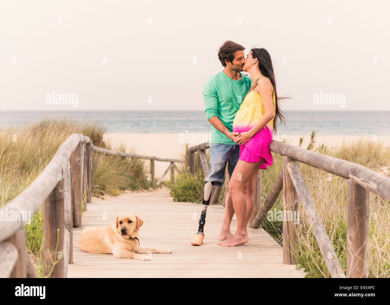 Disabled man and pregnant woman. A Couple in Love. Stock Photo