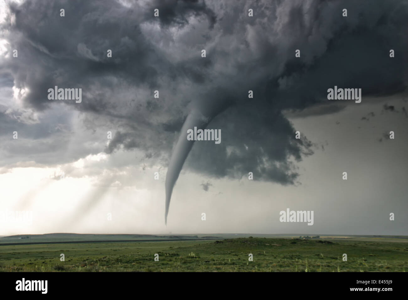 A perfectly needle-like cone tornado reaches out for the ground, Campo, Colorado, USA Stock Photo