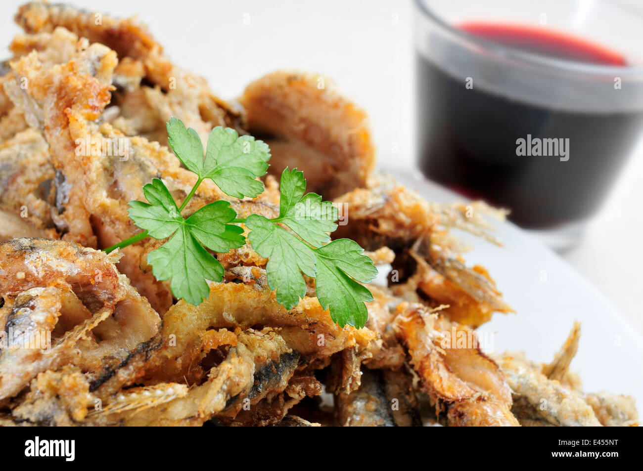 a plate with some spanish boquerones fritos, fried anchovies typical in Spain, served as tapas