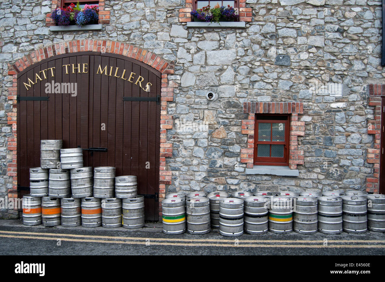 KILKENNY, IRELAND - AUGUST 6, 2012 : lot of kegs in front of the pub Matt the Millers on August 6, 2012 in Kilkenny, Ireland. Stock Photo