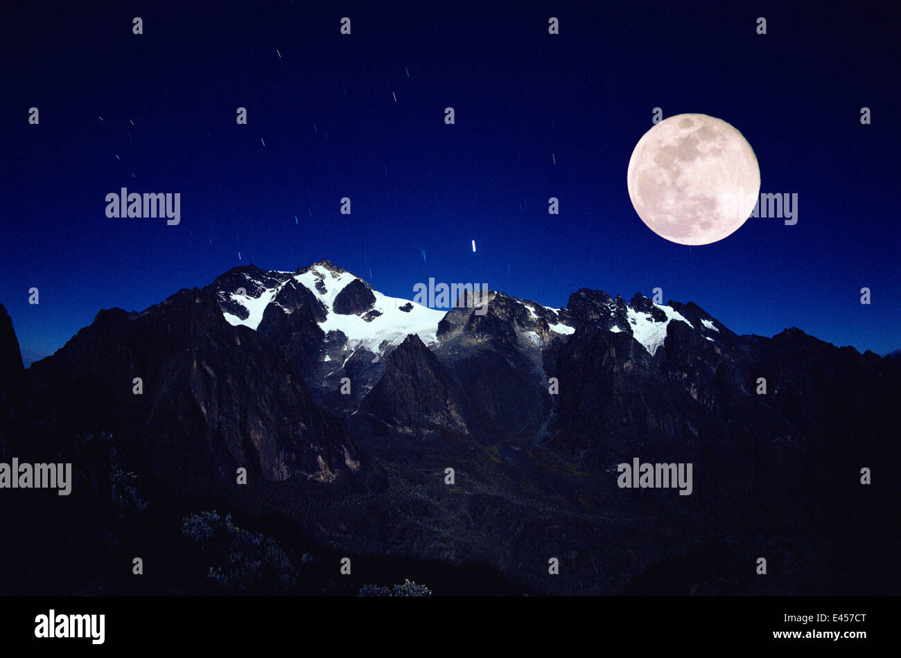 Full moon and stars over Mount Stanley, Mountains of the Moon, Ruwenzori mtns, Virunga NP, Dem Rep of Congo Stock Photo