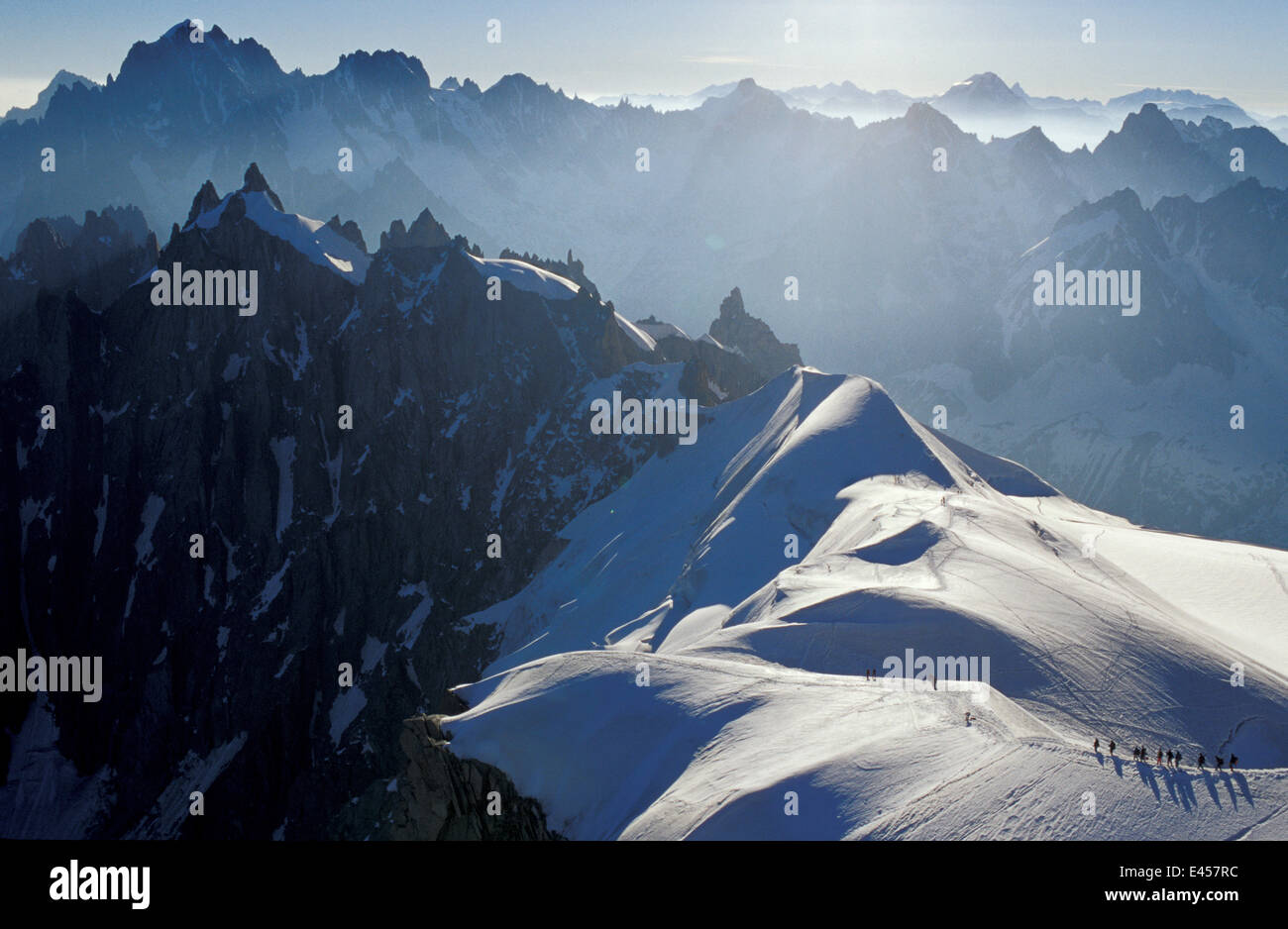 Climbers crossing the Plan de l'Aiguille, Aiguille du Midi, Alps, France Stock Photo
