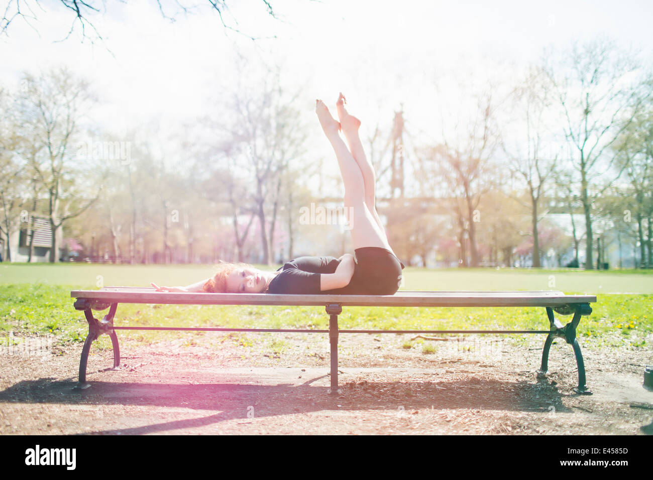 Modern dancer striking a pose in a urban park Stock Photo