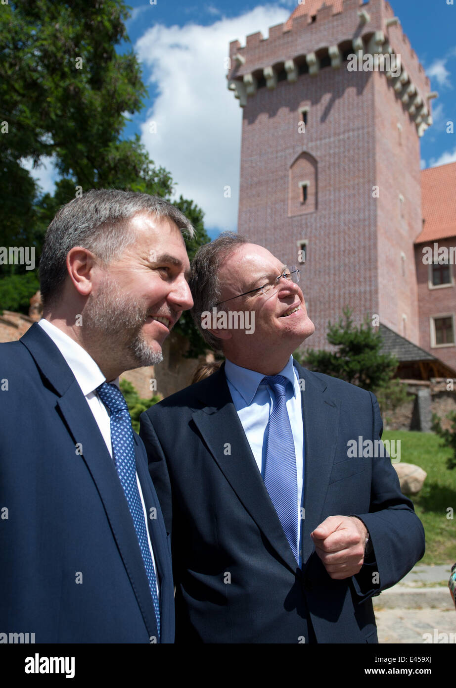 Poznan, Poland. 03rd July, 2014. President of the German Federal Council and Premier of Lower Saxony Stephan Weil (L) poses with Greater Poland Voivode Marek Wozniak in the historic inner city in Poznan, Poland, 03 July 2014. Weil is attending political talks in Warsaw in his role as Federal Council President. Photo: JOCHEN LUEBKE/dpa/Alamy Live News Stock Photo
