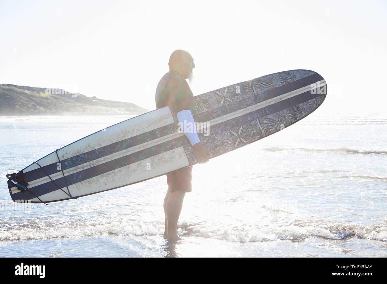 Mature male surfer watching hi-res stock photography and images - Alamy